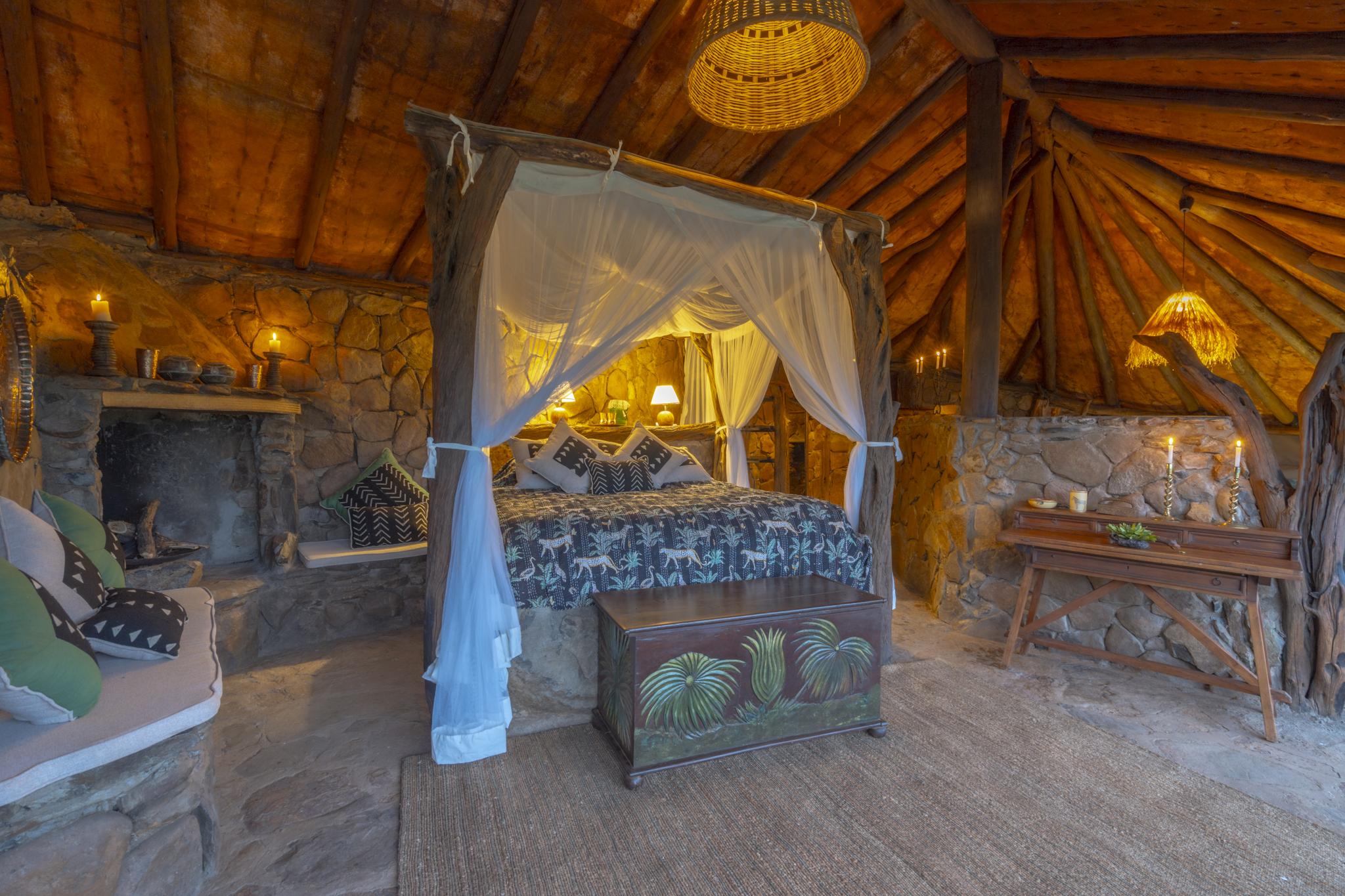 Luxurious canopy bed in an authentic African lodge at Mukutan Conservancy
