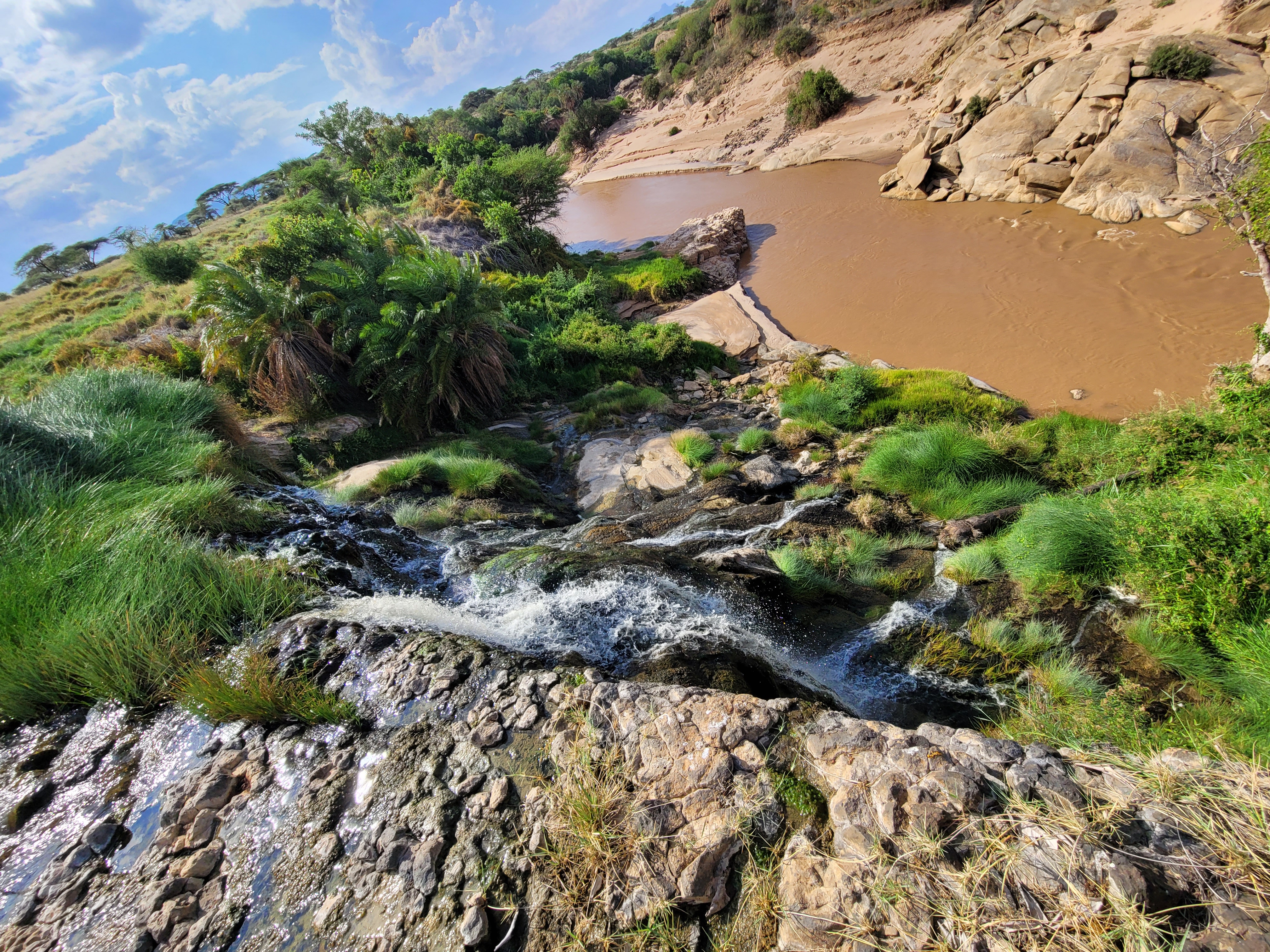 Scenic river flowing through rocky terrain in the African wilderness