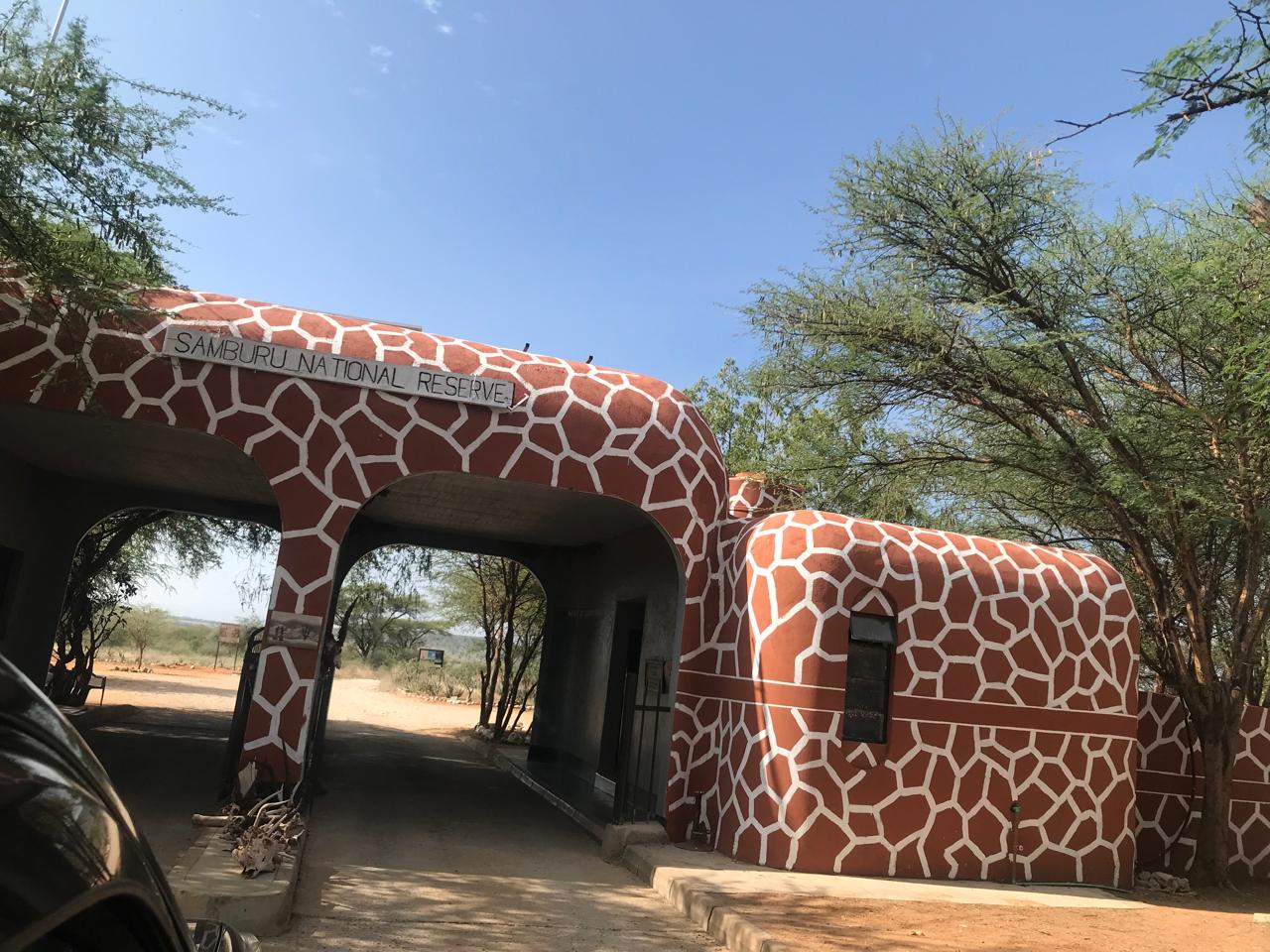 Iconic giraffe-patterned entrance gate to Samburu National Reserve in Northern Kenya