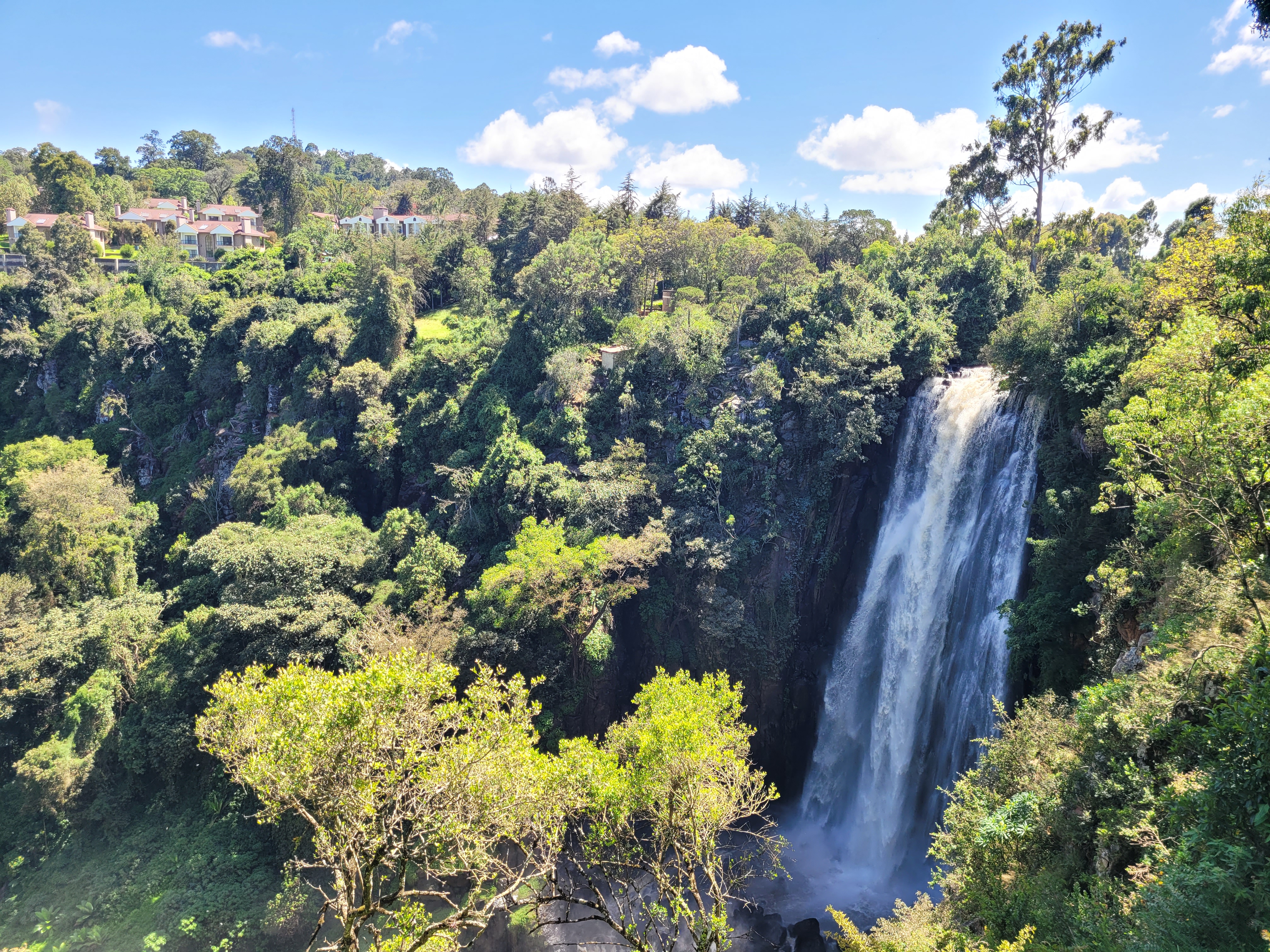 Spectacular Thomson Falls waterfall surrounded by lush green forest in Kenya